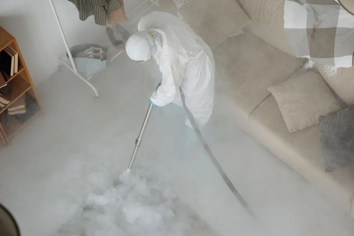 Biohazard cleanup technician in protective equipment, Nashville, AR